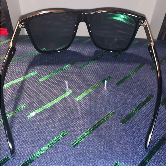 Prada unisex sunglasses, looks brand new. Sleek black with signature red stripe. - Picture 4 of 5